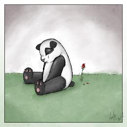 A sad panda sitting on grass